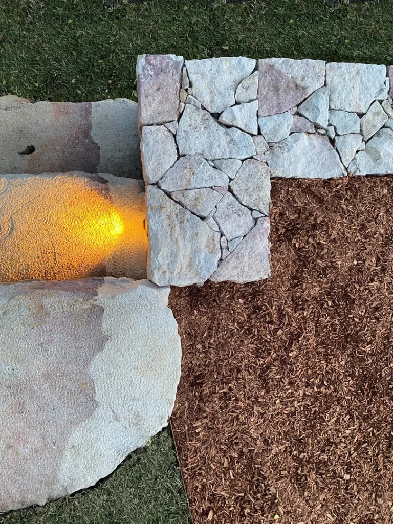 Stone path with mulch and grass landscaping