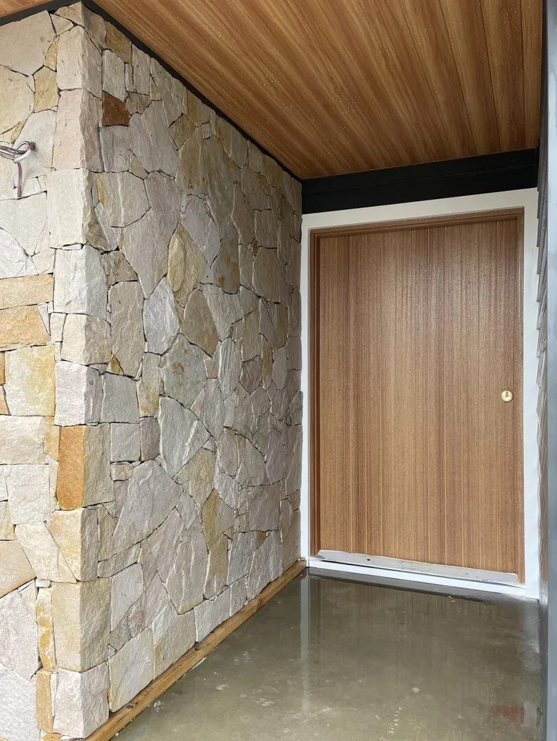 Stone wall and wooden door entrance