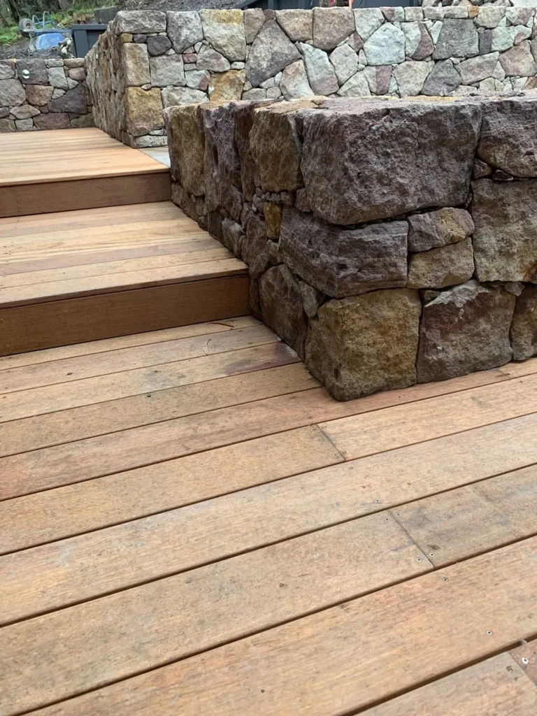 Wooden deck with stone retaining wall