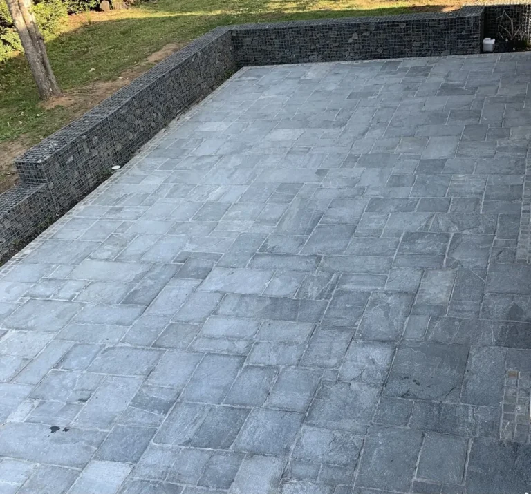 Stone patio with surrounding stone walls