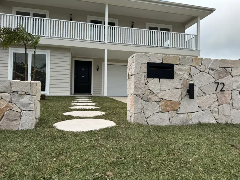 Modern house with stone walkway and balcony
