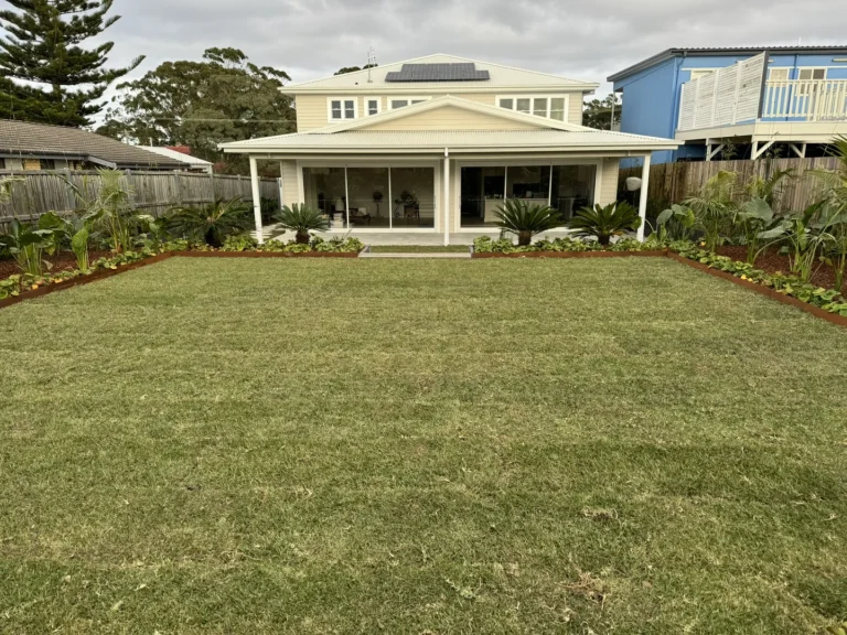 House with landscaped backyard and garden