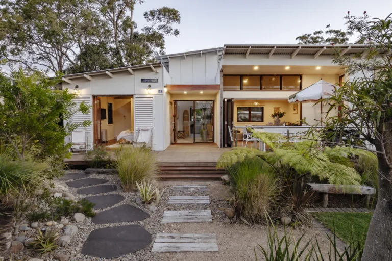 Modern home with garden path and open patio