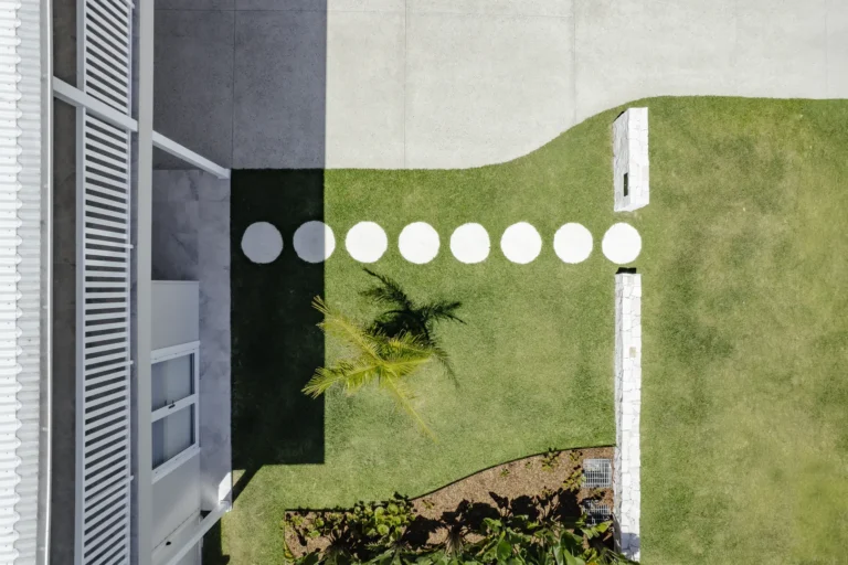Aerial view of modern lawn with circular stepping stones